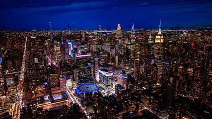 New York City night panorama. Wide aerial panorama of New York City glowing with lights after sunset © Vadim