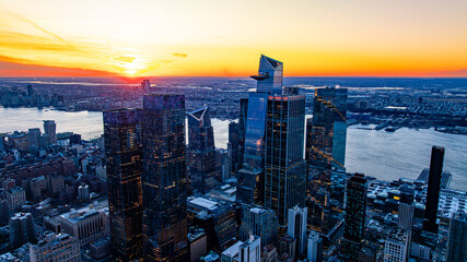 Hudson Yards skyline at sunset. Aerial view of Hudson Yards skyline overlooking the Hudson River at...