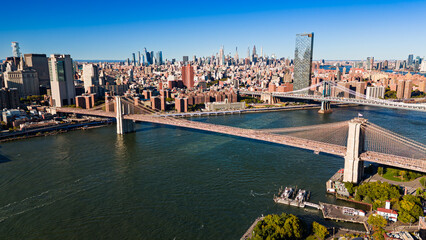 Fototapeta premium Manhattan skyline panorama over East River. Panoramic cityscape of Manhattan skyline above East River waters.