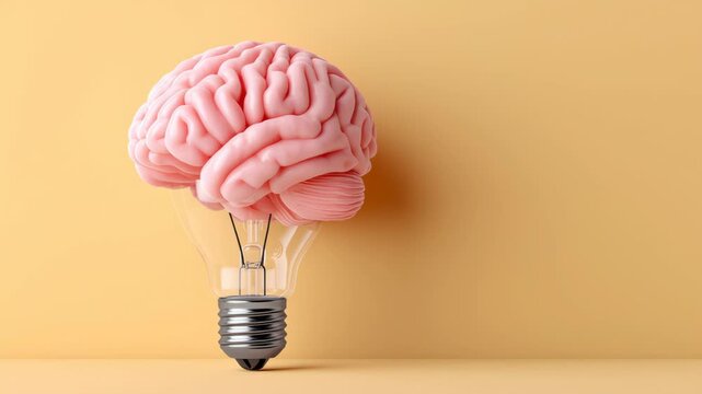 Pink brain model inside a light bulb on a yellow background, showcasing a creative concept of intelligence and innovation with a modern design aesthetic and clear visual appeal