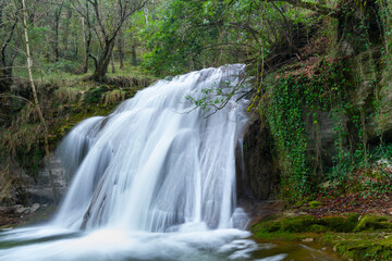 Fototapeta premium Waterfalls of the Hijuela River in Irus, in the Mena Valley. Merindades region. Burgos. Castile and León. Spain. Europe
