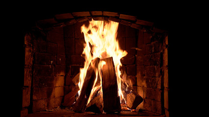 Blazing fire in a stone fireplace