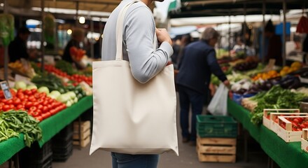 Person holding a reusable bag at a vibrant market stall with fresh produce on display