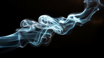Fototapeta premium Ethereal blue smoke waves on black background