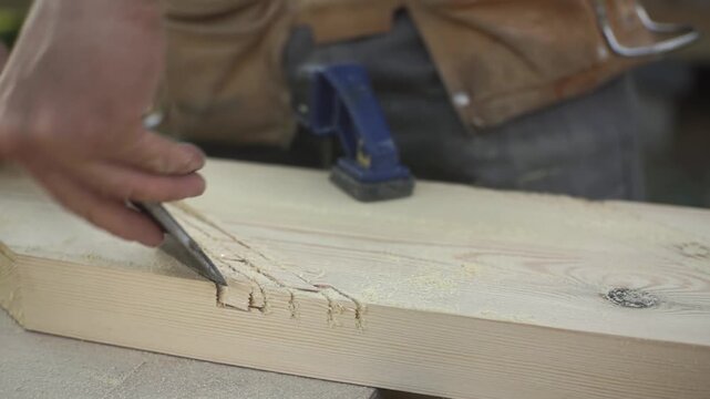 Groove in a board. Steel axe. Macro. Carpentry. Slow motion video.High quality FullHD footage