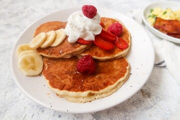 Gluten free almond meal pancakeds served with fresh berries