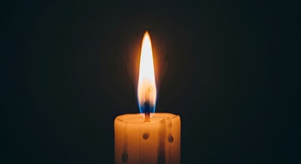 Single lit candle in darkness.