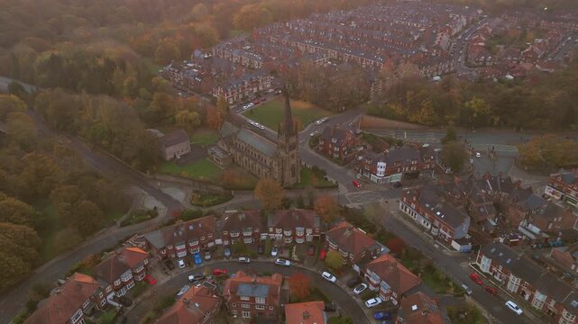 Church in Jesmond at dawn with nearby houses and trees in view, highlighting the morning light and neighbourhood layout. 360-degree pano shot