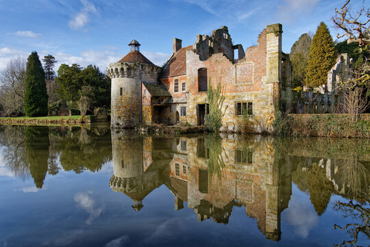 Reflections in the Moat of an English Castle on a calm bright sunny late winters day