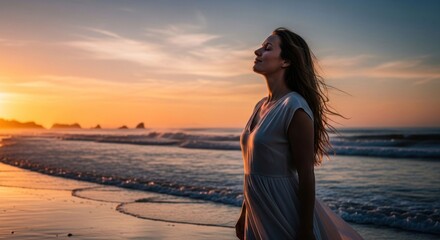 Woman on beach enjoying sunset's warmth, feeling serene