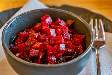 Beetroot salad in bowl and fork.