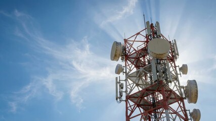 Communication Tower Against Blue Sky with Radiant Sunlight