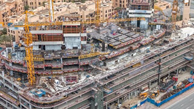 Drone Timelapse shot of an active construction site and cranes in Downtown Saudi Arabia. Football 2034 preparation at Saudi Arabia.