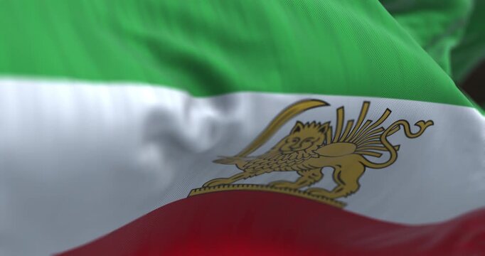 Close-up of Iran Pahlavi-era Lion and Sun flag waving in the wind