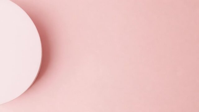 Playback starting pink disc sliding inward showing form on studio backdrop drop shadow, copy space