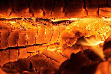 Burning firewood in a rural stove. Traditional stove in the countryside. Close-up