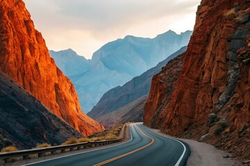 Winding mountain road through majestic red cliffs