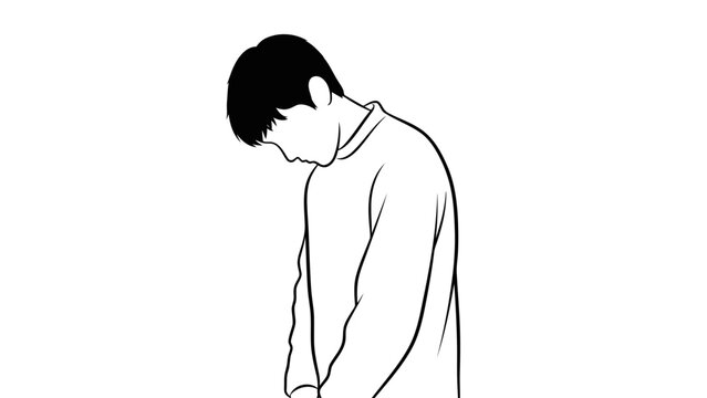 Sad man standing alone with head down