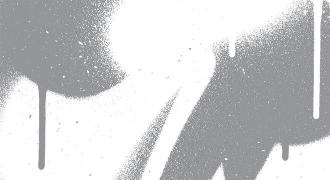 Abstract gray spray paint drips and splatters on a white background creating a grunge texture.