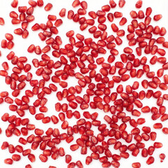 Obraz premium A large volume of pomegranate arils scattered across a white surface