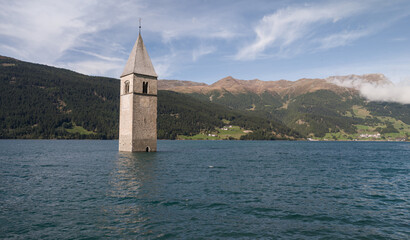 Scenic Landscape View of the Submerged Bell Tower in Lake Reschen