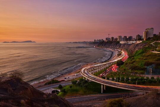 Miraflores AT SUNSET.The sparkling lights of La Costa Verde meet the calm waves of the Pacific, creating a scene straight out of a dream . Lima Peru