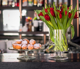Many donuts on a glass tray
