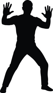 Silhouette of a man with hands up in surrender or defensive pose