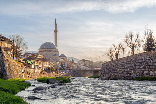 View of sinan pasha mosque by the river in Prizren, Kosovo during evening light