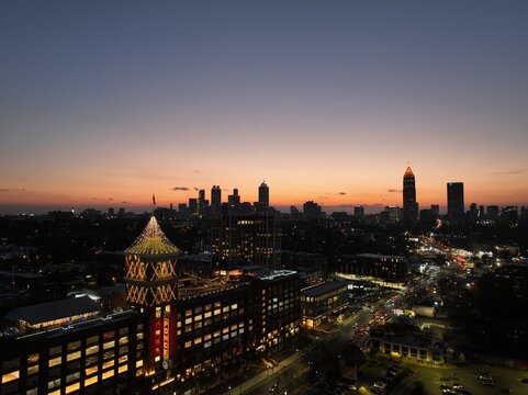 Beautiful golden hour done photo of Atlanta's Ponce City Market and the grand silhouette of Atlanta's skyline.