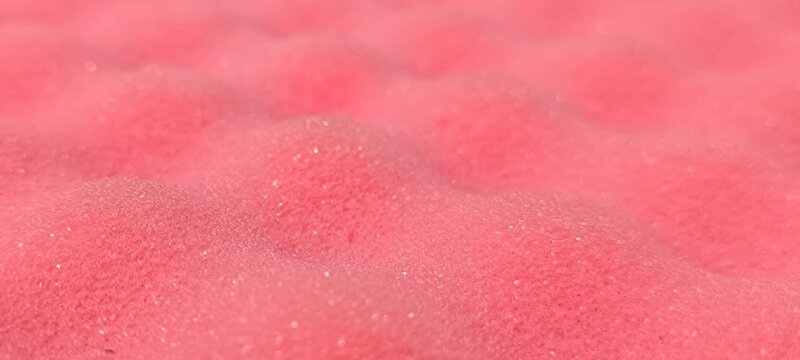 Pink foam for cushioning in box packaging.