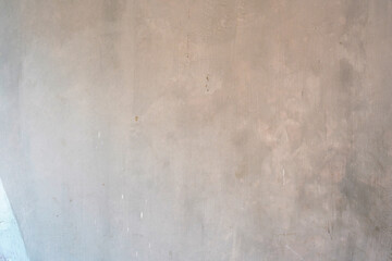 Obraz premium Textured gray concrete wall surface with subtle imperfections and a smooth finish