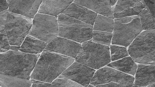 Gray Natural Stone Wall Texture Background with Rough Rock Surface for Architecture, Industrial Design and Construction Projects