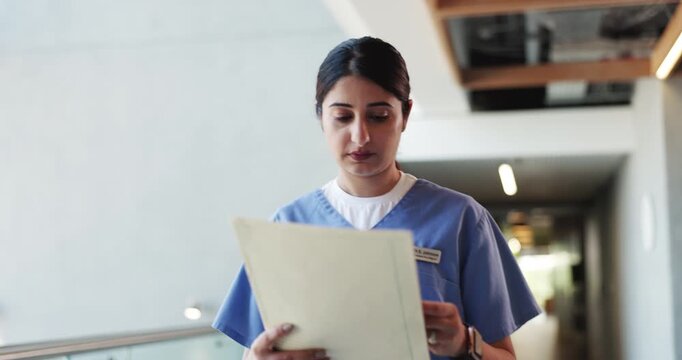 Nurse, folder and reading with woman in hospital for treatment plan, patient history or medical report. Healthcare diagnosis, insurance paperwork and checkup records with person for doctor referral
