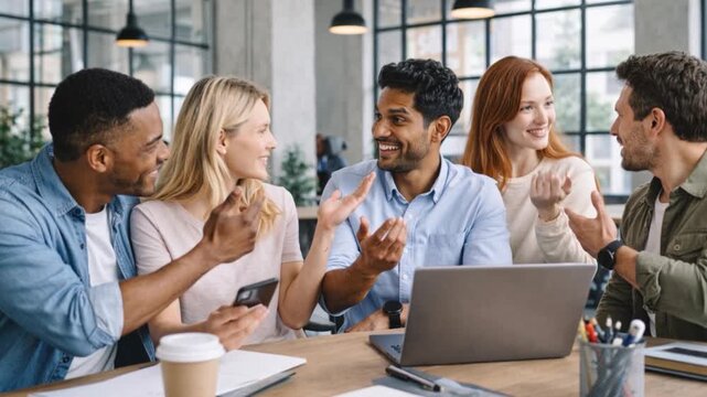 Group of young businespeople working together at modern office.
