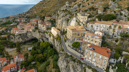 Fototapeta premium Aerial view of the municipal park of the cave located near the Tyrrhenian Sea coast. Panorama of Amantea historic center, in the province of Cosenza, Calabria, Italy. It is a karst cavity. 