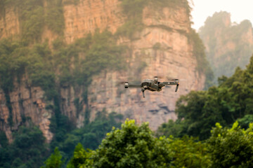 Fototapeta premium The drone with the professional camera takes pictures in Zhangjiajie national forest park,Wulingyuan,Hunan,China