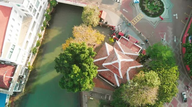 Malacca river and skyline on a sunny day, aerial view from drone