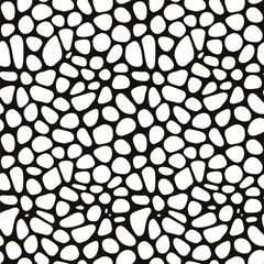Abstract black and white pattern resembling organic irregular pebble shapes