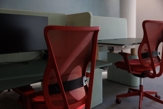 Two empty office desks and chairs, modern design.