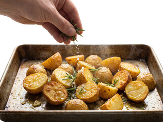Freshly roasted potatoes garnished with herbs and seasoned to perfection.