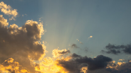 Sun Rays Shining Through Clouds at Sunset