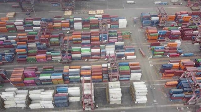 aerial view callao container port rows colorful stacked containers cranes and trucks crane operators