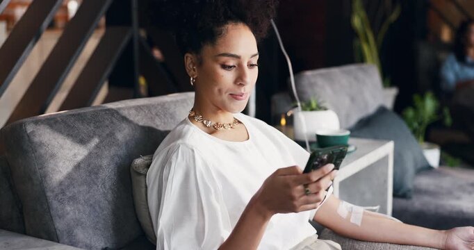 Woman, reading and iv infusion with phone for chemotherapy, minerals and browsing website. Female person, typing or mobile with injection drip for cancer treatment, social media and chat notification