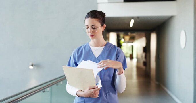 Nurse, documents and walking with woman in hospital for treatment plan, patient history or medical report. Healthcare results, insurance paperwork or checkup records with person for doctor referral