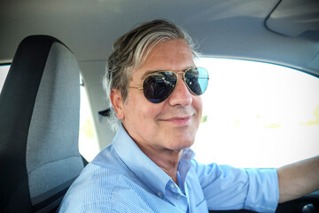 Adult man driving a car