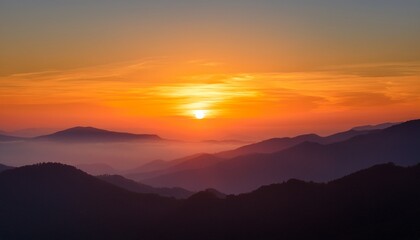 Fototapeta premium a calming dawn breaking over a still mountain range with subtle shades of orange and yellow illuminating the sky