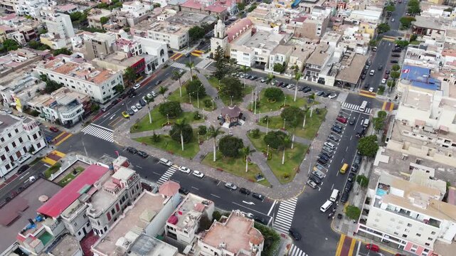 aerial view central plaza Callao Lima showing treelined square, busy intersection with taxis and
