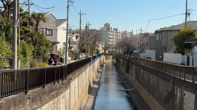 Urban residential canal in Tokyo suburb on a clear winter day