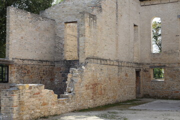Fototapeta premium brick, stone walls, doors, windows of preserved historic faith building (landscape, summer, ruins)